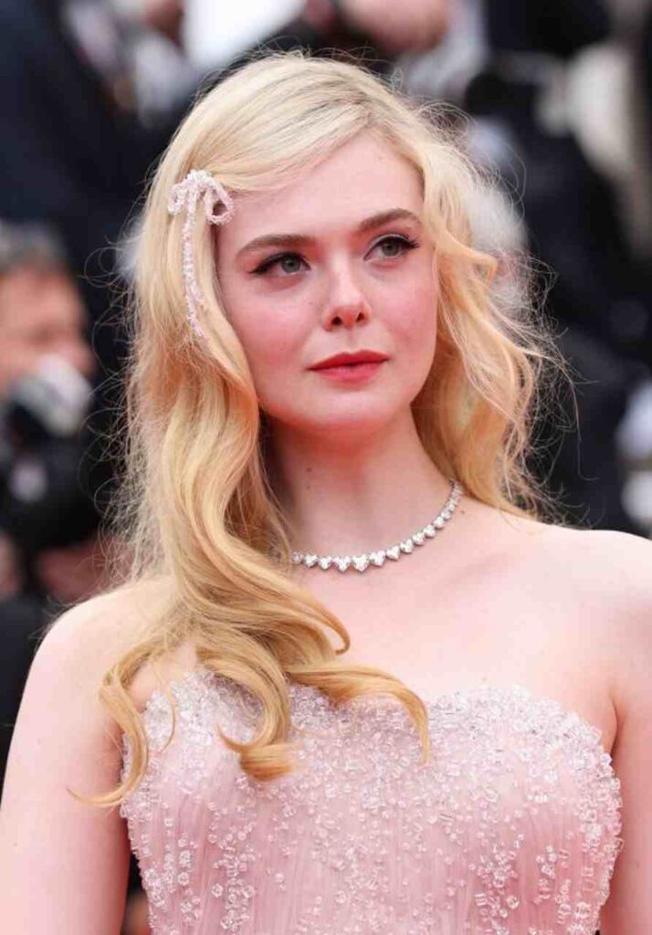 GIRL.BLACK: ELLE FANNING. TOP GUN: MAVERICK. RED CARPET, AT CANNES FILM FESTIVAL. MAJESTIC STYLE.