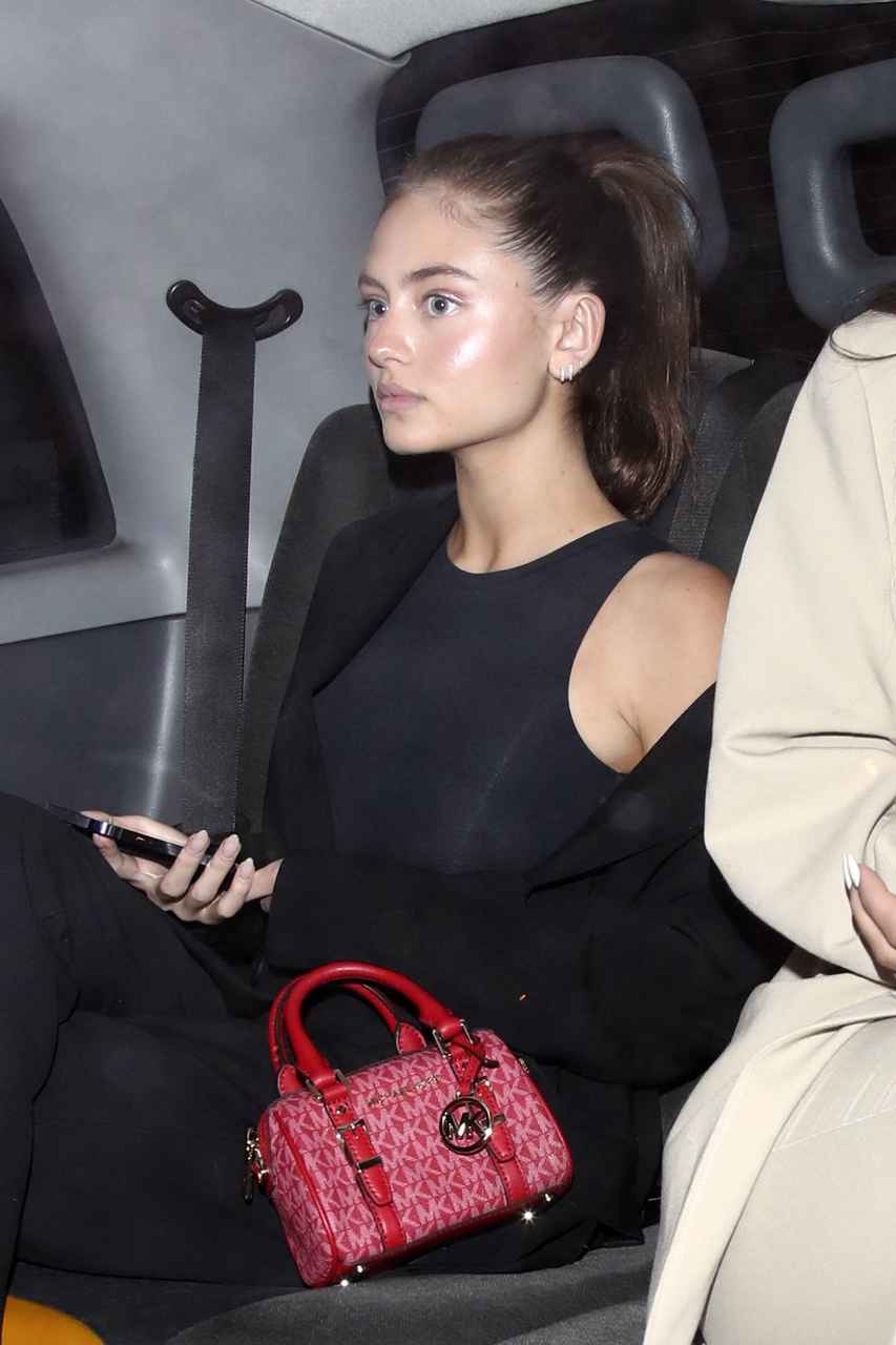 GIRL.BLACK: LENI KLUM. LEAVING THE CHILTERN FIREHOUSE, IN LONDON.