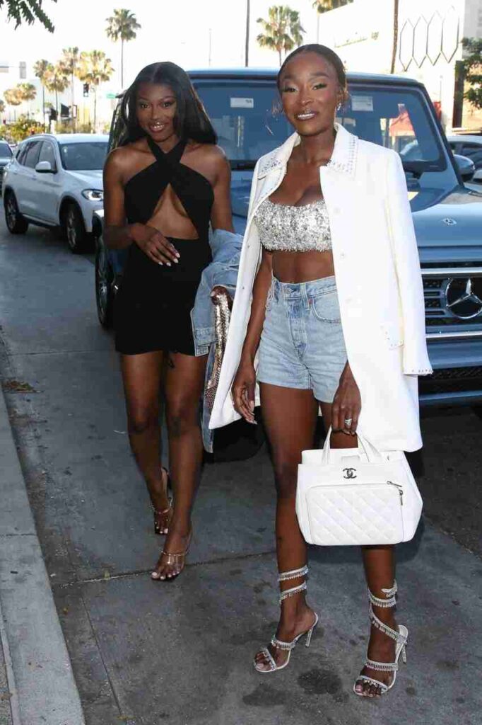 GIRL.BLACK: CHELSEA LAZKANI IN A DESIGNER PAIR OF DAISY DUKES AND PATRICIA BRIGHT, AT AVRA, IN BEVERLY HILLS. SUMPTUOUS STYLE.